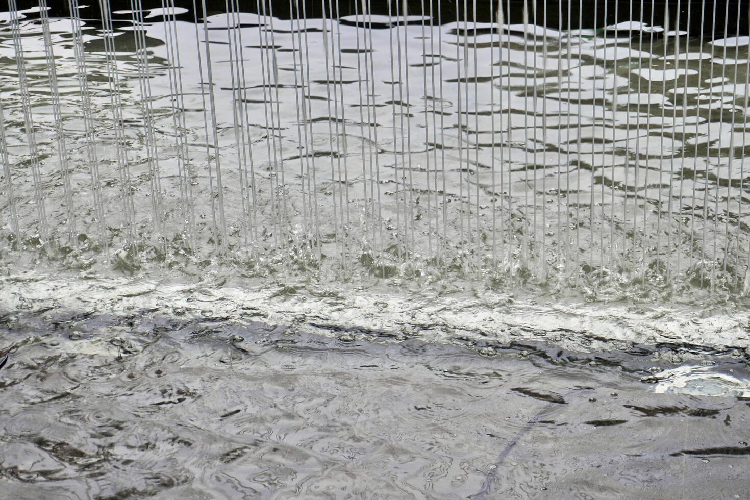Water curtain droplets texture isolated on horizontal background. photo
