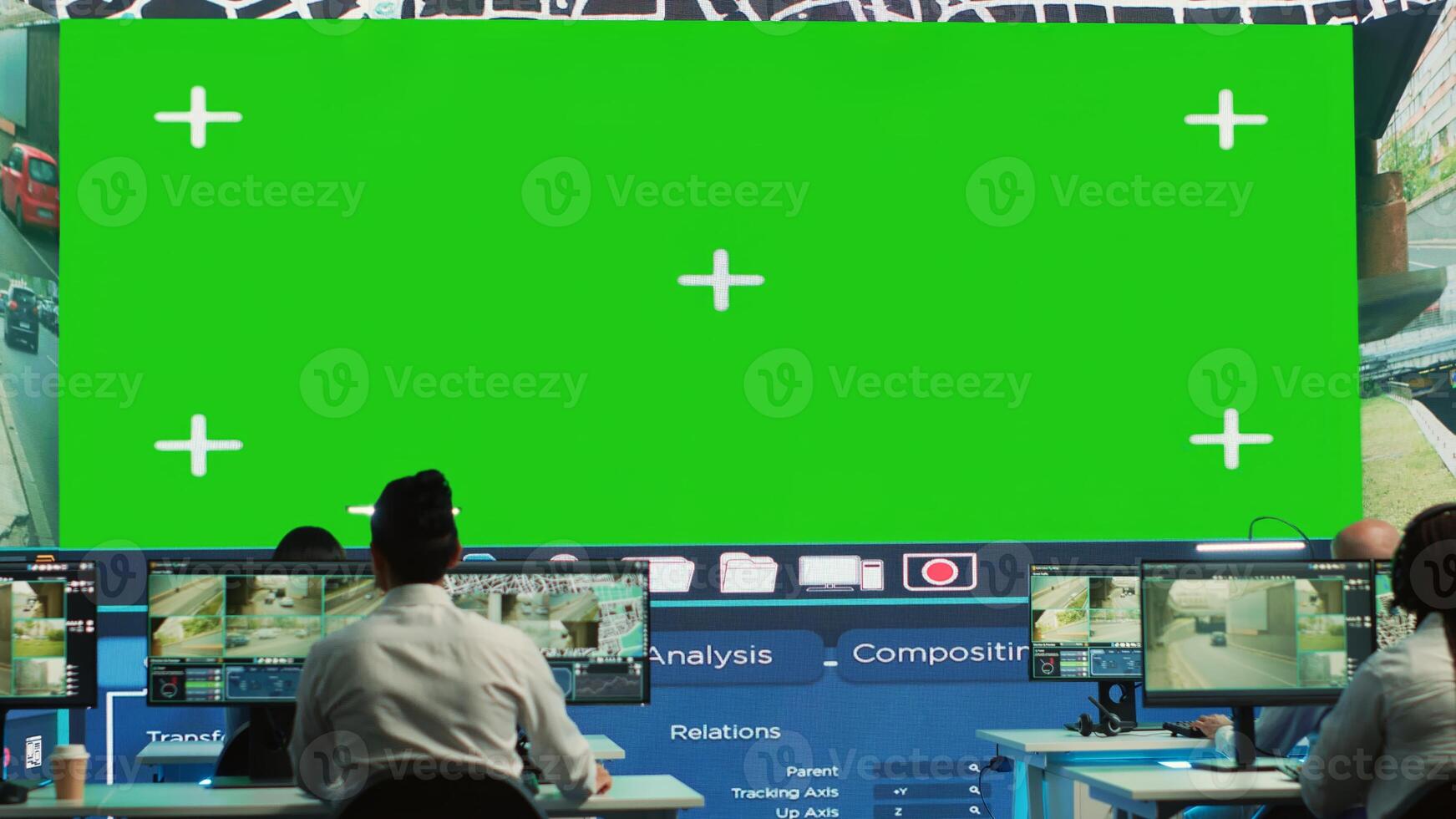 Shipping agency workers examine satellite map with huge greenscreen display, monitoring parcels and orders for clients. Employees using surveillance CCTV footage to get updates. Camera A. photo