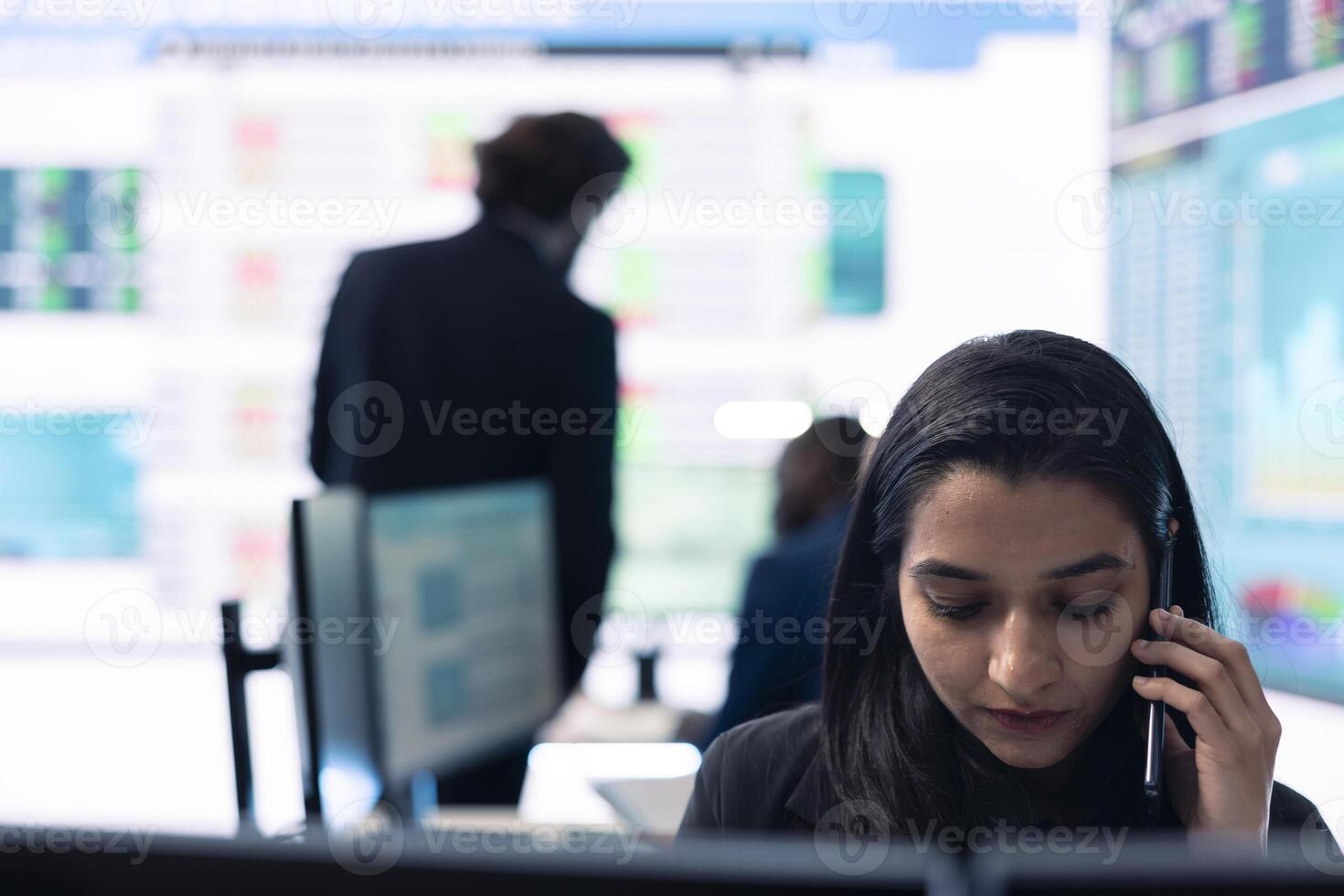 Business associate presents daily tasks order to enterprise administrator, discussing on phone call about funding and resources allocation in order to expand globally. Teamwork. photo