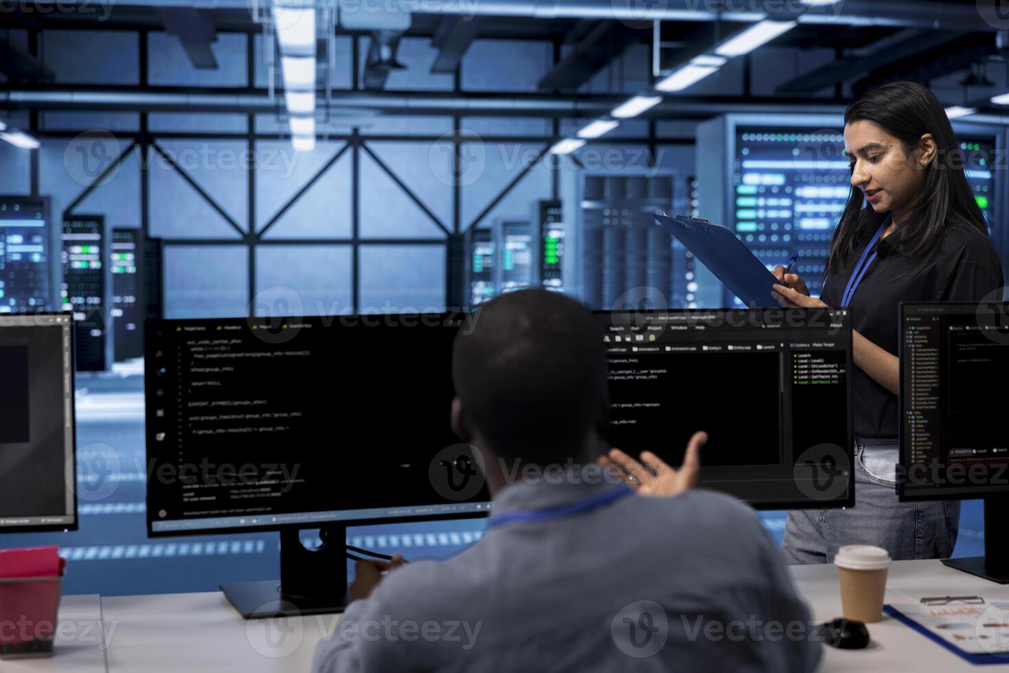 Engineer in server farm checking recovery plan, monitoring data center energy consumption. Employee in server room making sure sensors are functioning optimally, doing routine disk checks photo