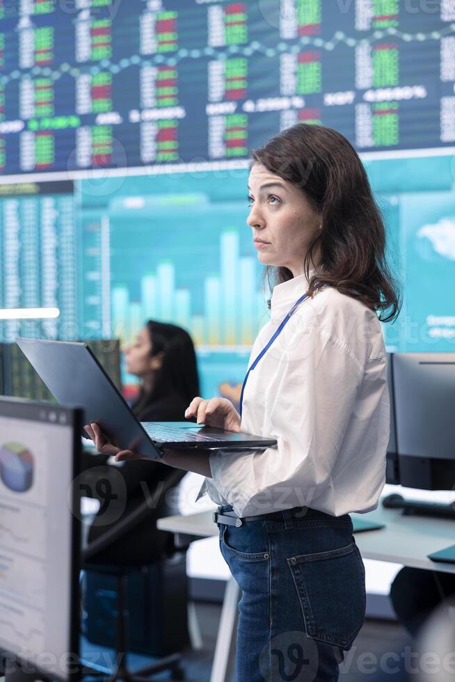 Business operator gathering insight on key performance indicators for shareholders, communicating organizational progress in order to expand the company internationally. Teamwork. photo