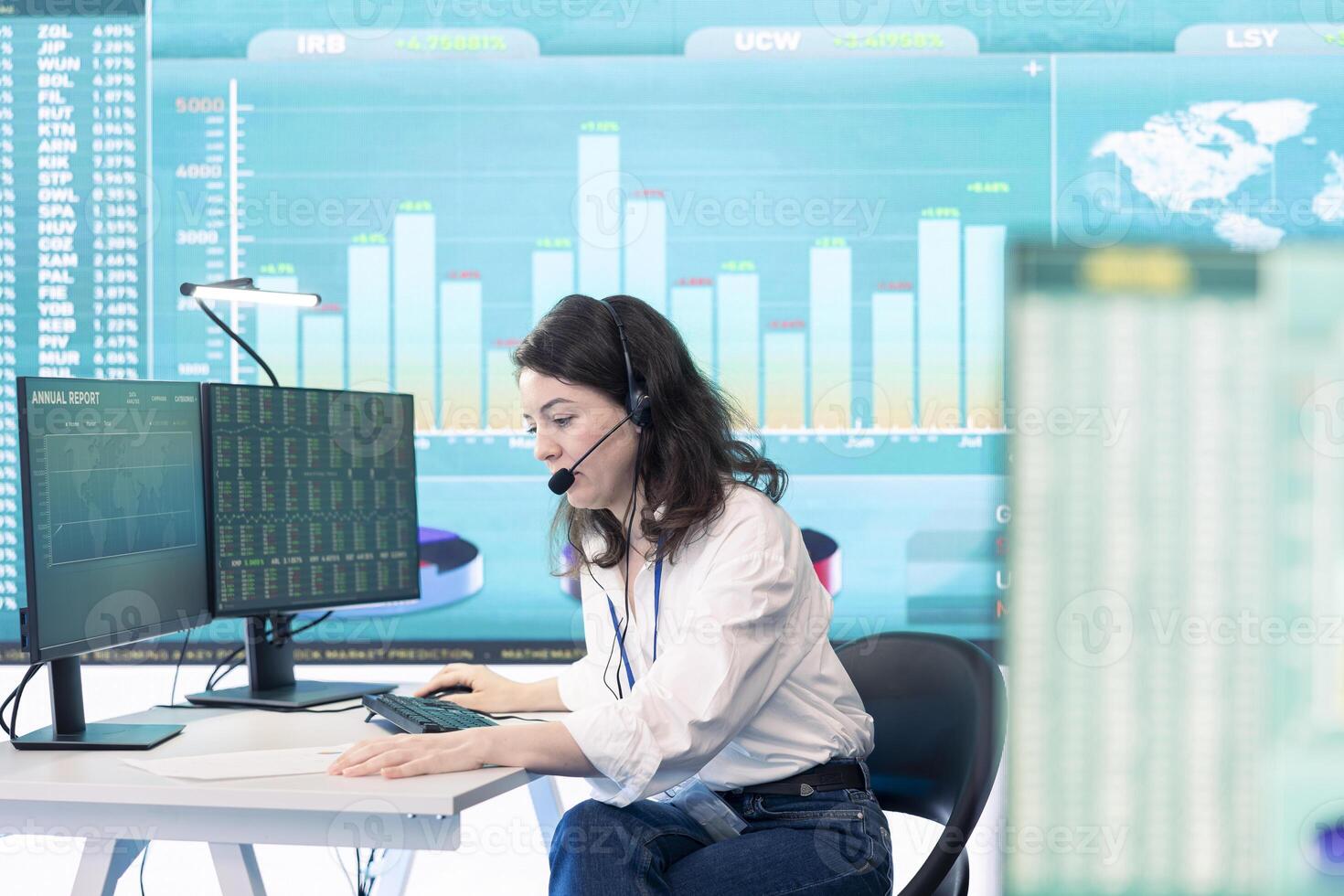 Office administrator exploring global partnership opportunities for the firm, establishing current enterprise goals. Forecast associates are doing a win or loss study, monitoring room. photo