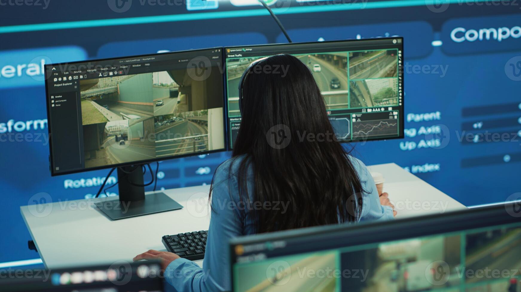 Indian call center operator gives order delivery updates to clients, handling shipment delay complains in control center. Cargo shipping agency directing trucks on less busy routes. Camera A. photo