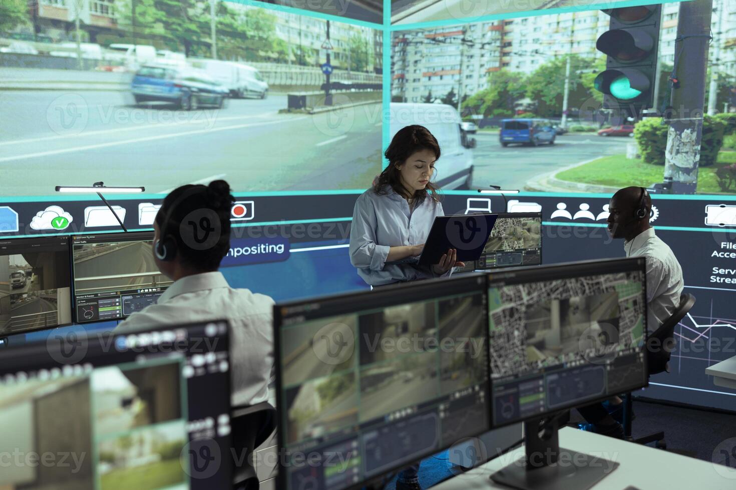 Team of control center employees gather information about cars in traffic, monitoring urban activity in the city via CCTV surveillance footage on security cameras. Database tracking. photo