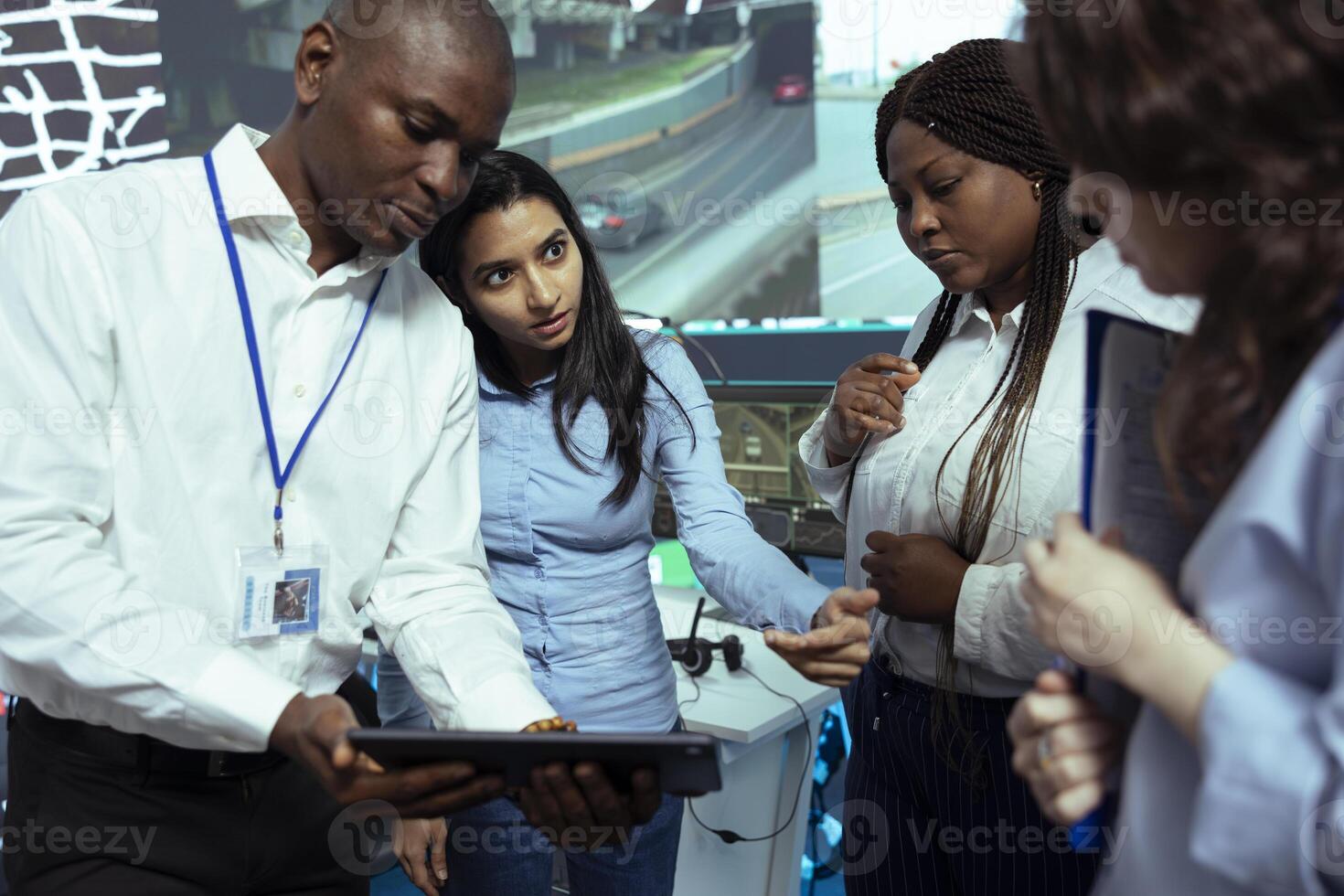Team of diverse employees analyzing order logistics on awb papers, finding the shipment location and fixing the gps coordinates on satellite map. Group of operators work on express delivery. photo