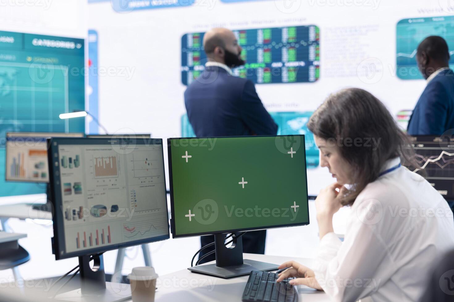 Woman general manager works with green screen and annual reports on computer, ensuring progress and overall business success. Skilled consultant reviews the current budget situation. photo
