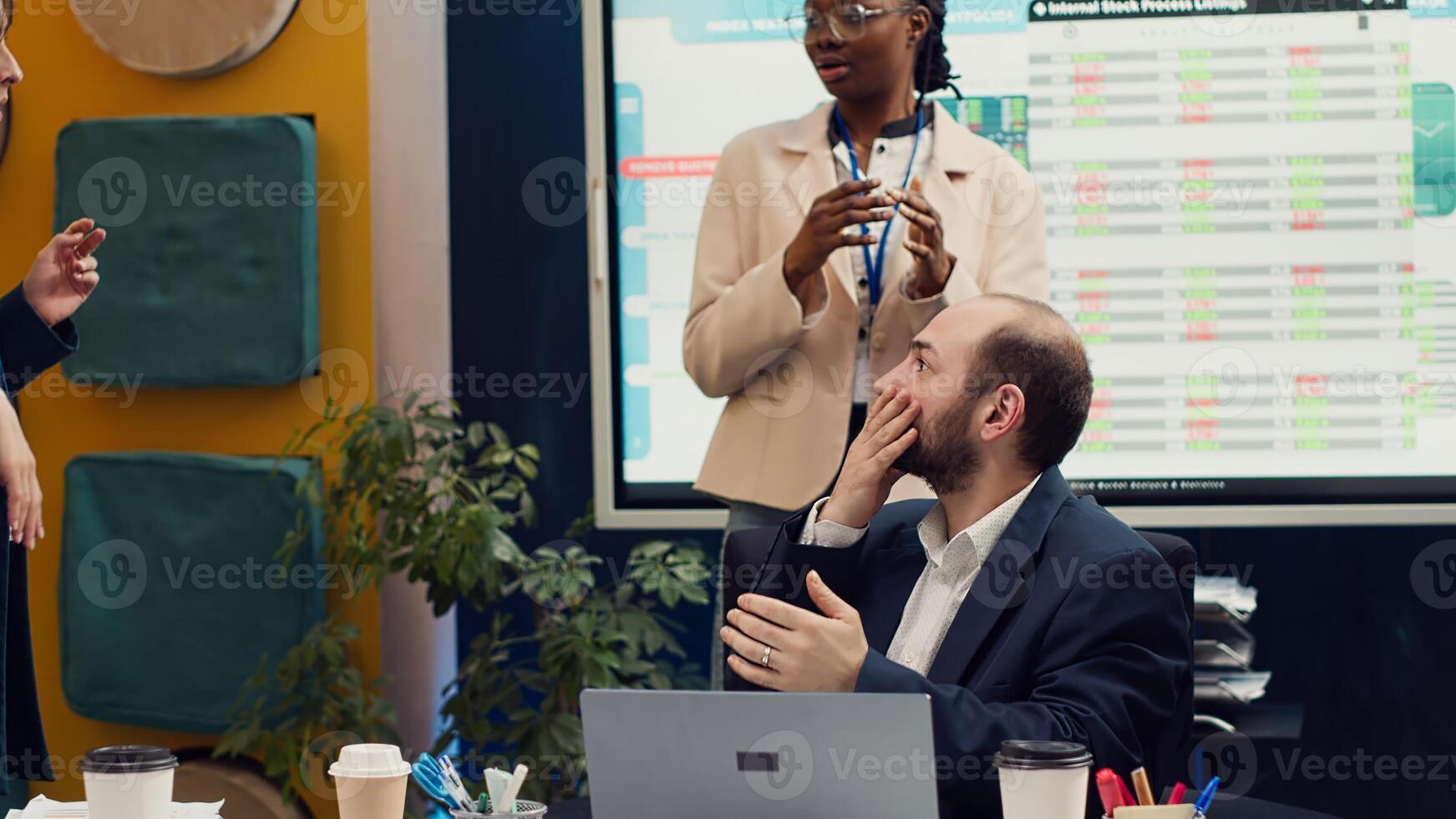 Joyful supervisor accidentally kissing his employee in excitement, being too cheerful and excited about the new team achievement. Irritated woman slapping him after kissing her. Camera A. photo