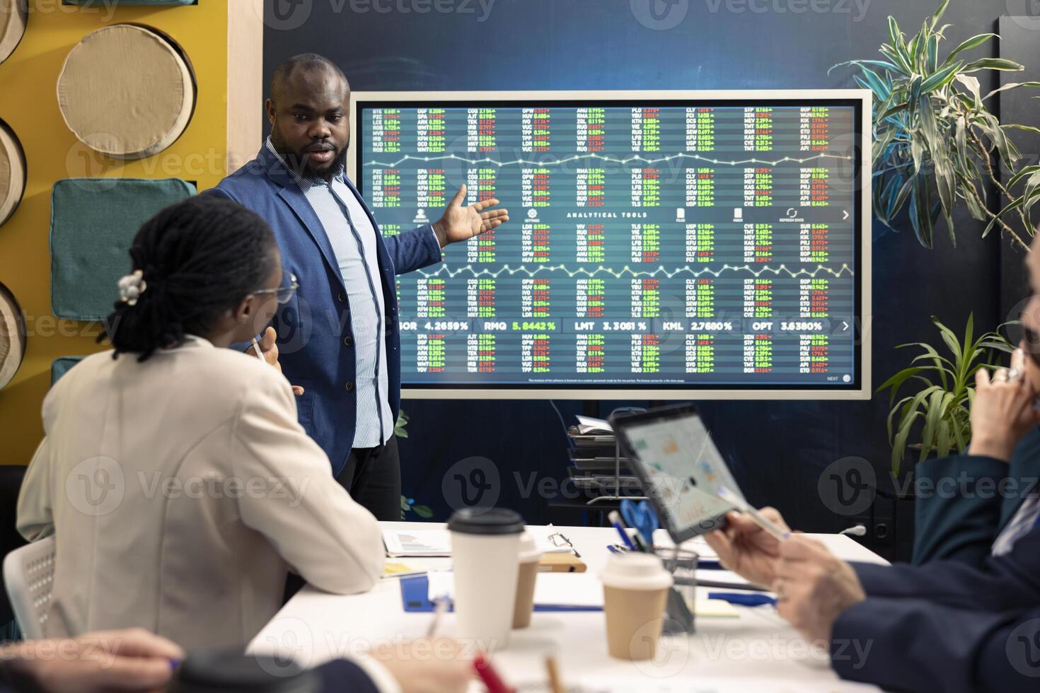 Team leader hosting a meeting in conference room and talking sense into his staff, trying to detect challenges or obstacles hindering progress. Manager and workers struggling with a project. photo