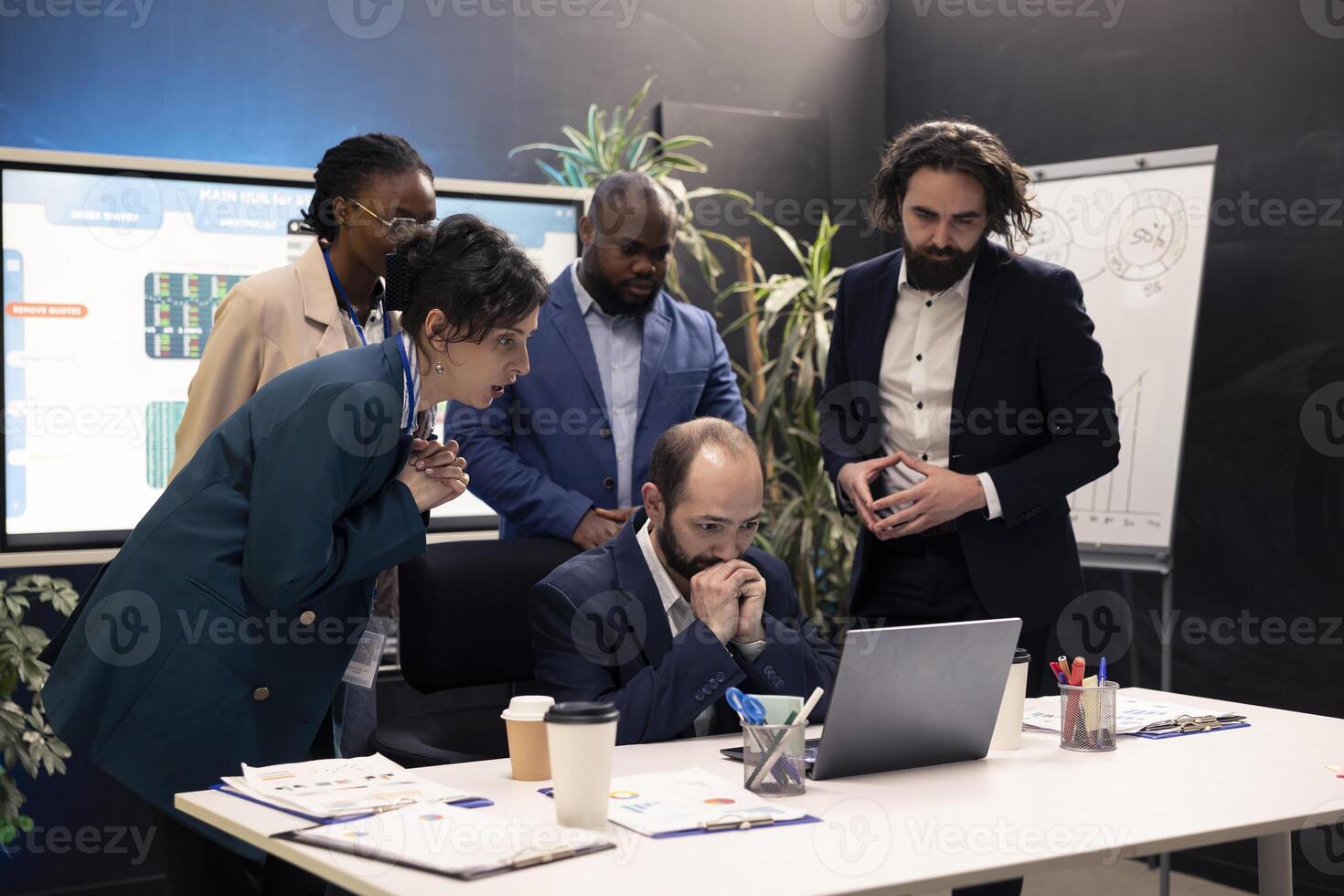 Business workers analyzing project updates and details to ensure goal achievement, evaluating statistics data on laptop and finding ways to obtain new capital. Enterprise management team. photo