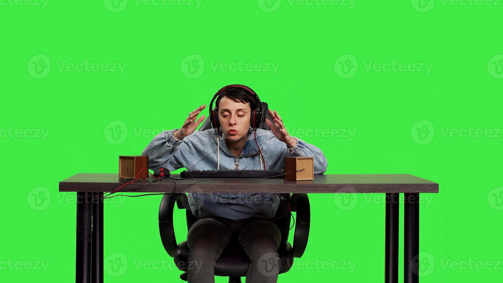 POV woman getting frustrated about losing online gaming tournament, playing games sitting at desk. Player feeling furious and disappointed with her failure, greenscreen backdrop. Camera B. photo