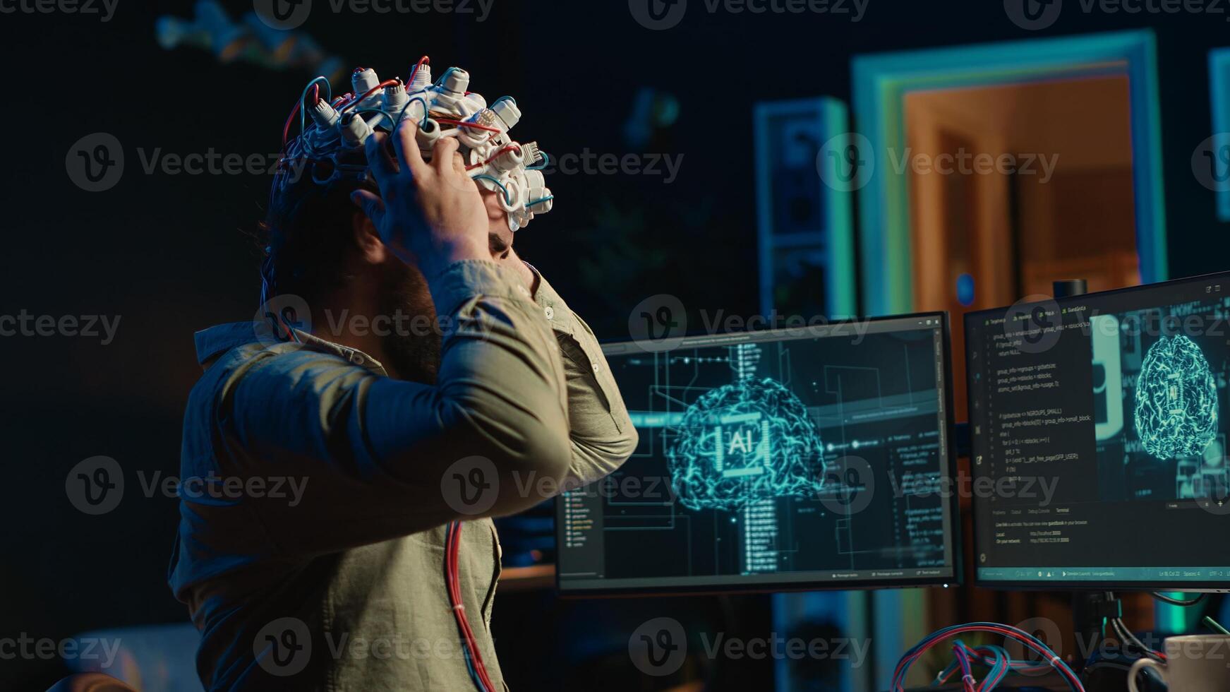 Man puts EEG headset on to transfer mind into computer virtual world, becoming one with AI superintelligence. Engineer using futuristic neuroscientific technology to transfer consciousness, camera A photo