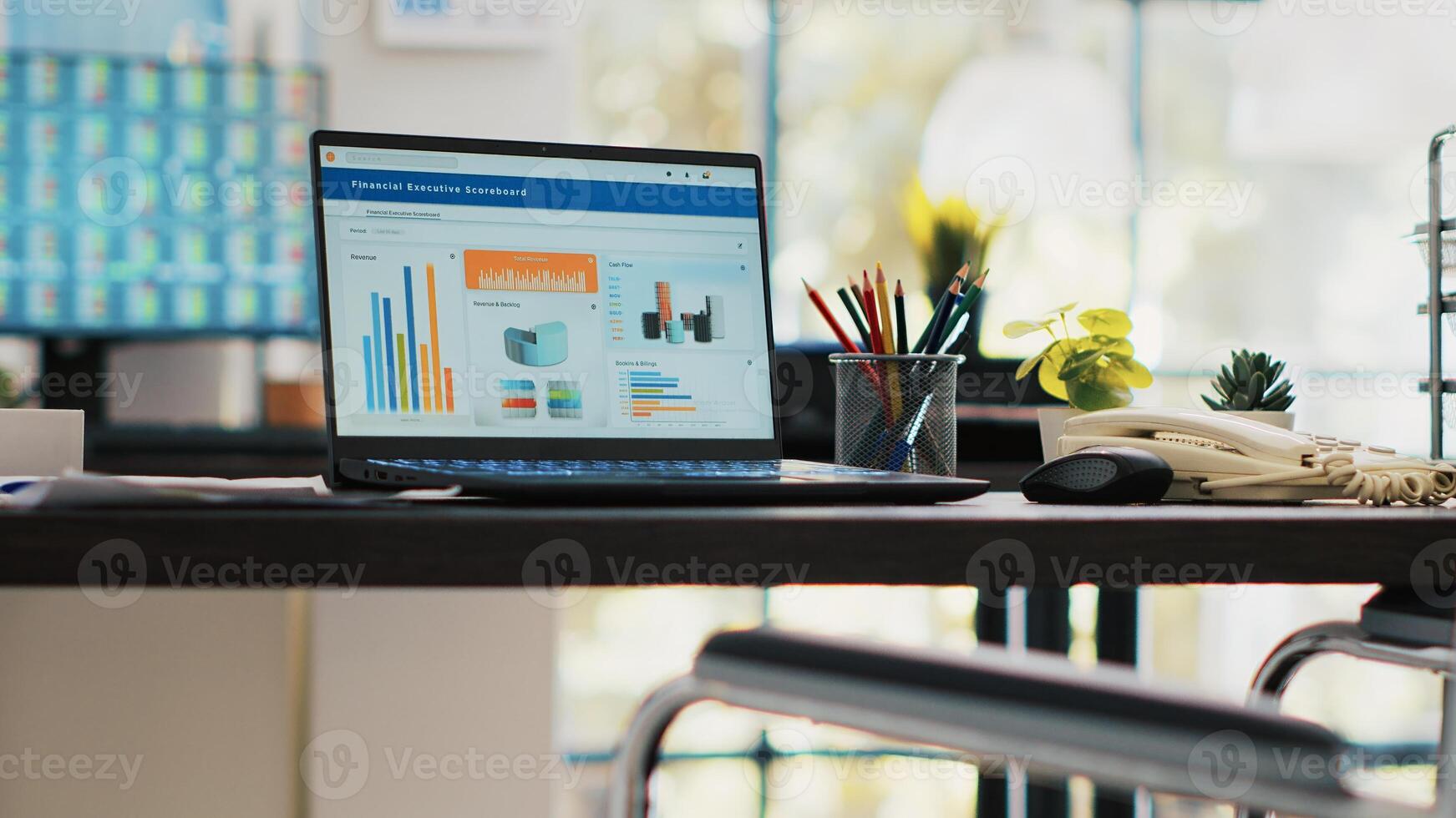 Wheelchair in inclusive office for employees and laptop on desk showing statistics. Medical chair in workspace offering accessibility to workers with disability and notebook with financial charts photo