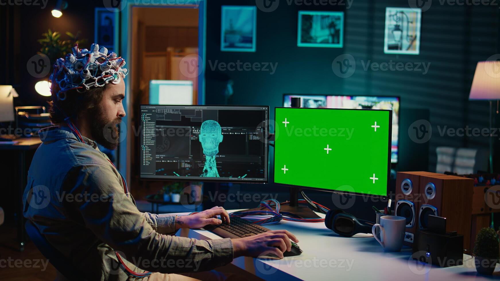 Developer using EEG headset, starting mind upload process using isolated screen desktop. Man using neuroscientific device to transfer consciousness into cyberspace with chroma key monitors, camera B photo