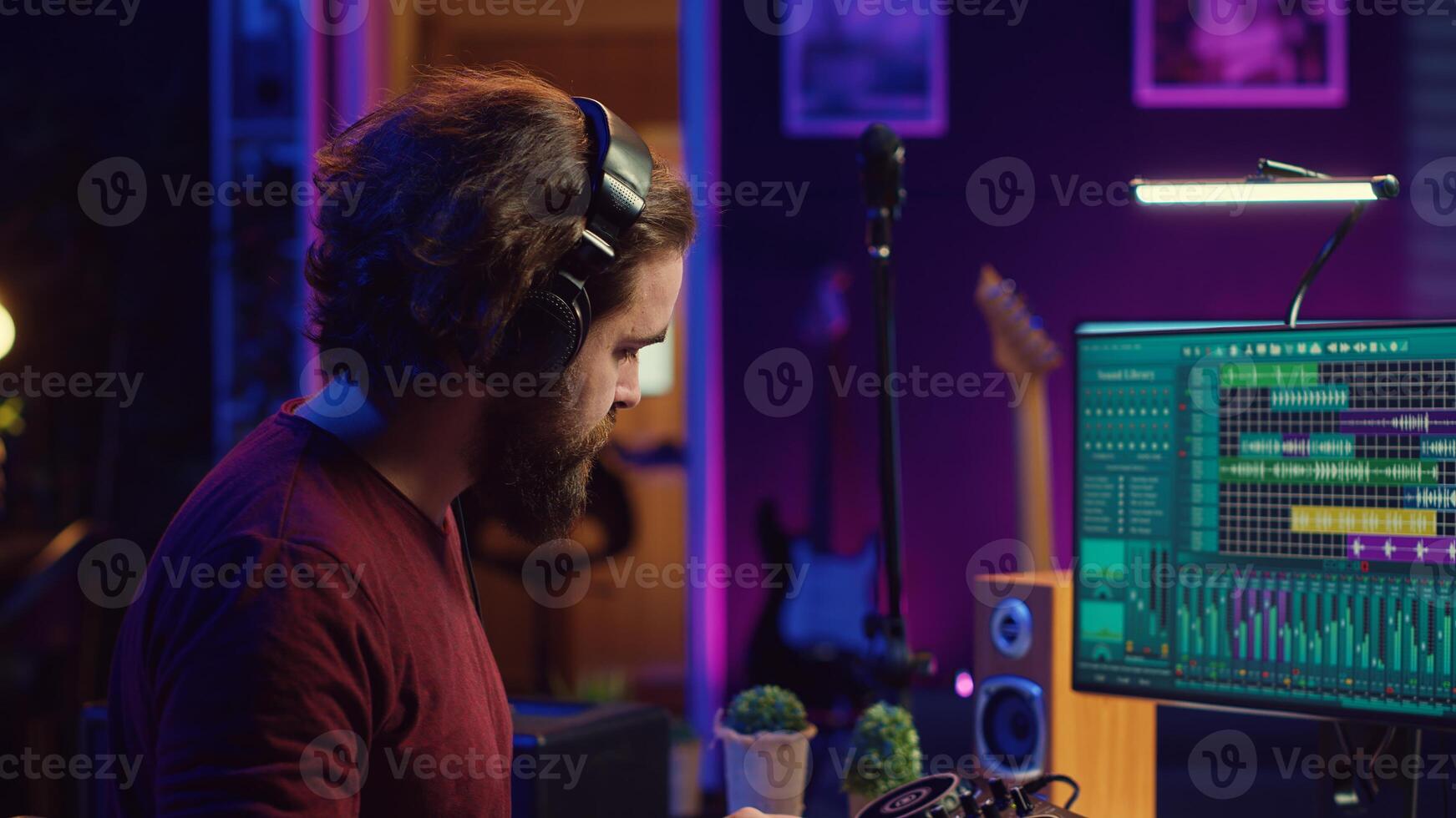 Mastering engineer registering piano keys recordings to edit in daw software on computer, operating his mixing equipment. Artist works on editing and manipulating recorded sounds and tunes. Camera A. photo