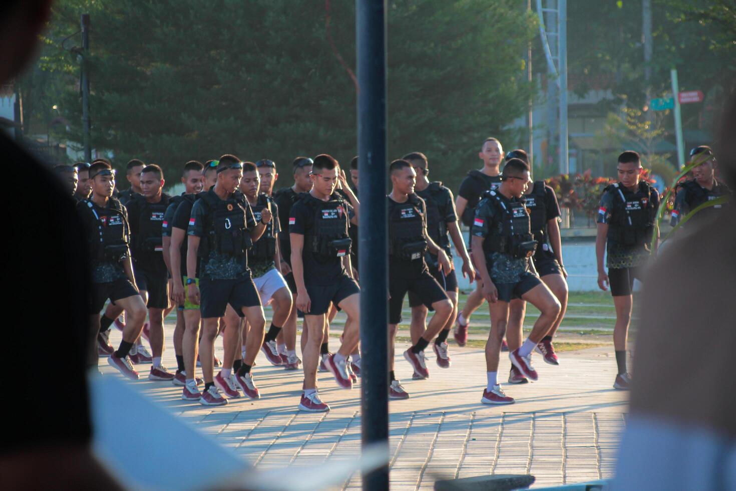 Lombok, March 2 2024, Indonesia - a group of young Indonesian soldiers are training in Loang Balok park in the morning photo