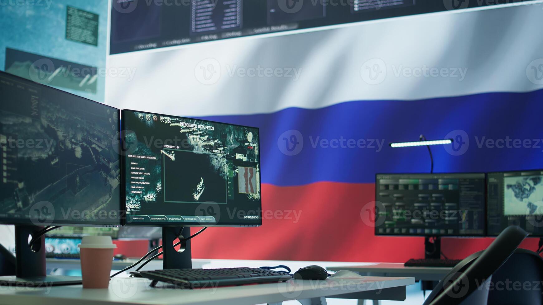 Empty russian military control center with a big screen presenting the national flag, spreading fake news and propaganda to brainwash the people. Inflicting fear among the population. Camera B. photo
