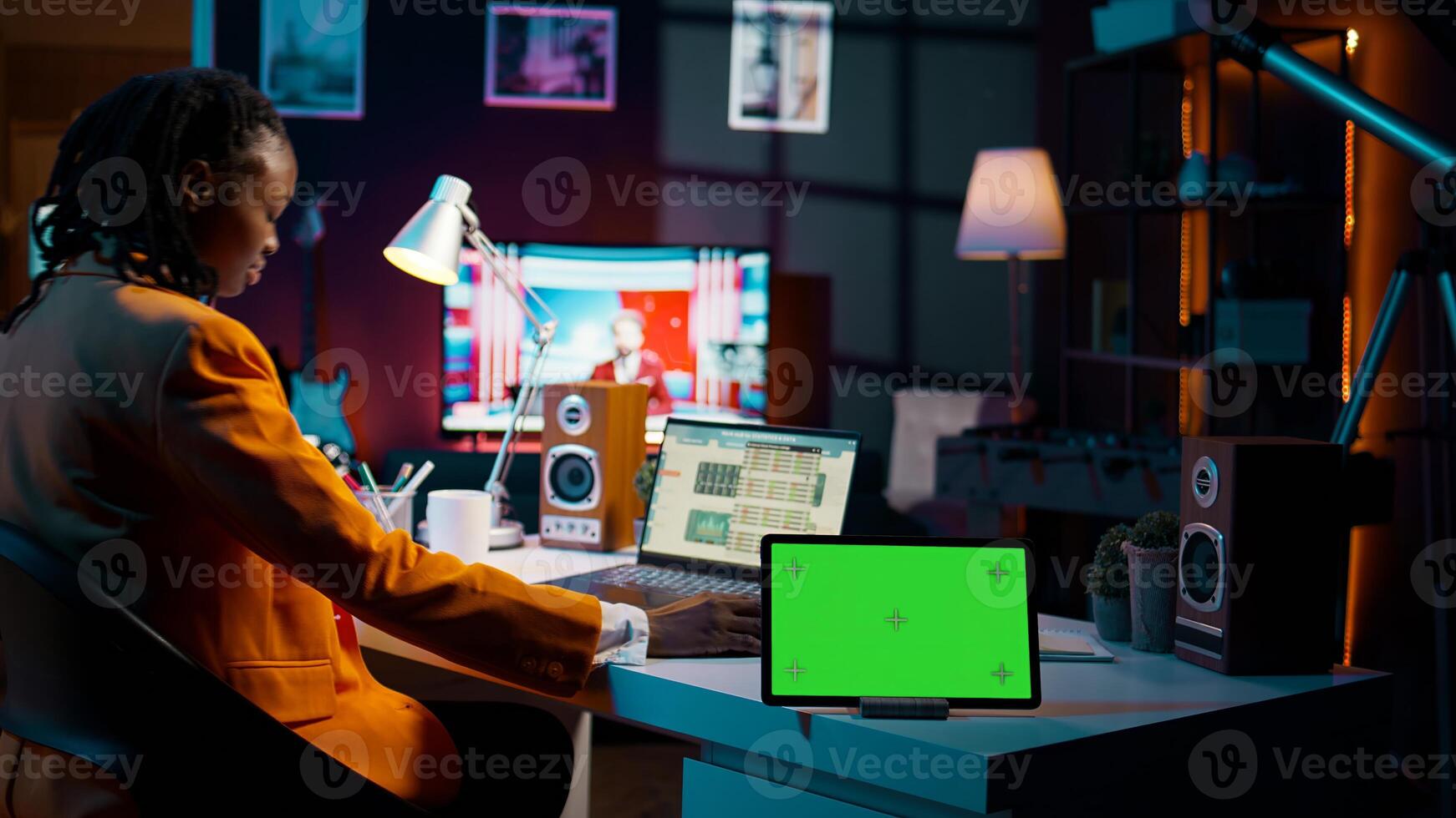 African american pupil looks at greenscreen display on tablet, learning to calculate cost and opportunity. Young woman working on financial software for economics classes. Camera B. photo