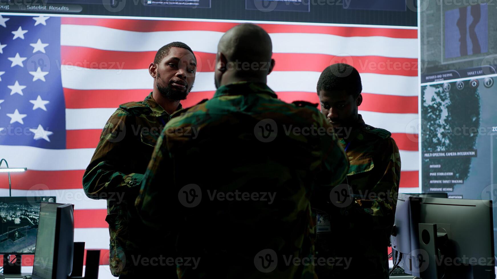 American army officers in a high tech command center monitor cybersecurity threats, manage classified information and state secrets. Hybrid warfare strategy for the government. Camera A. photo