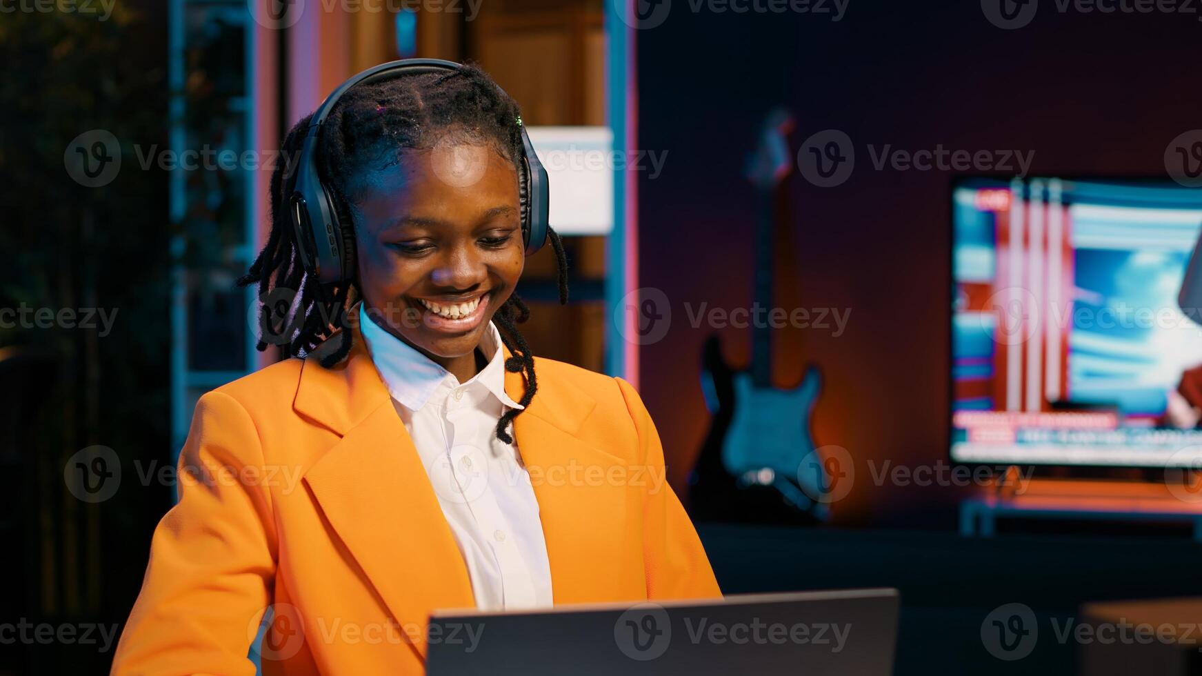 Young woman participating in online debate forums or academic competitions to learn case studies relevant to university coursework. African american girl listening to web webinar. Camera A. photo