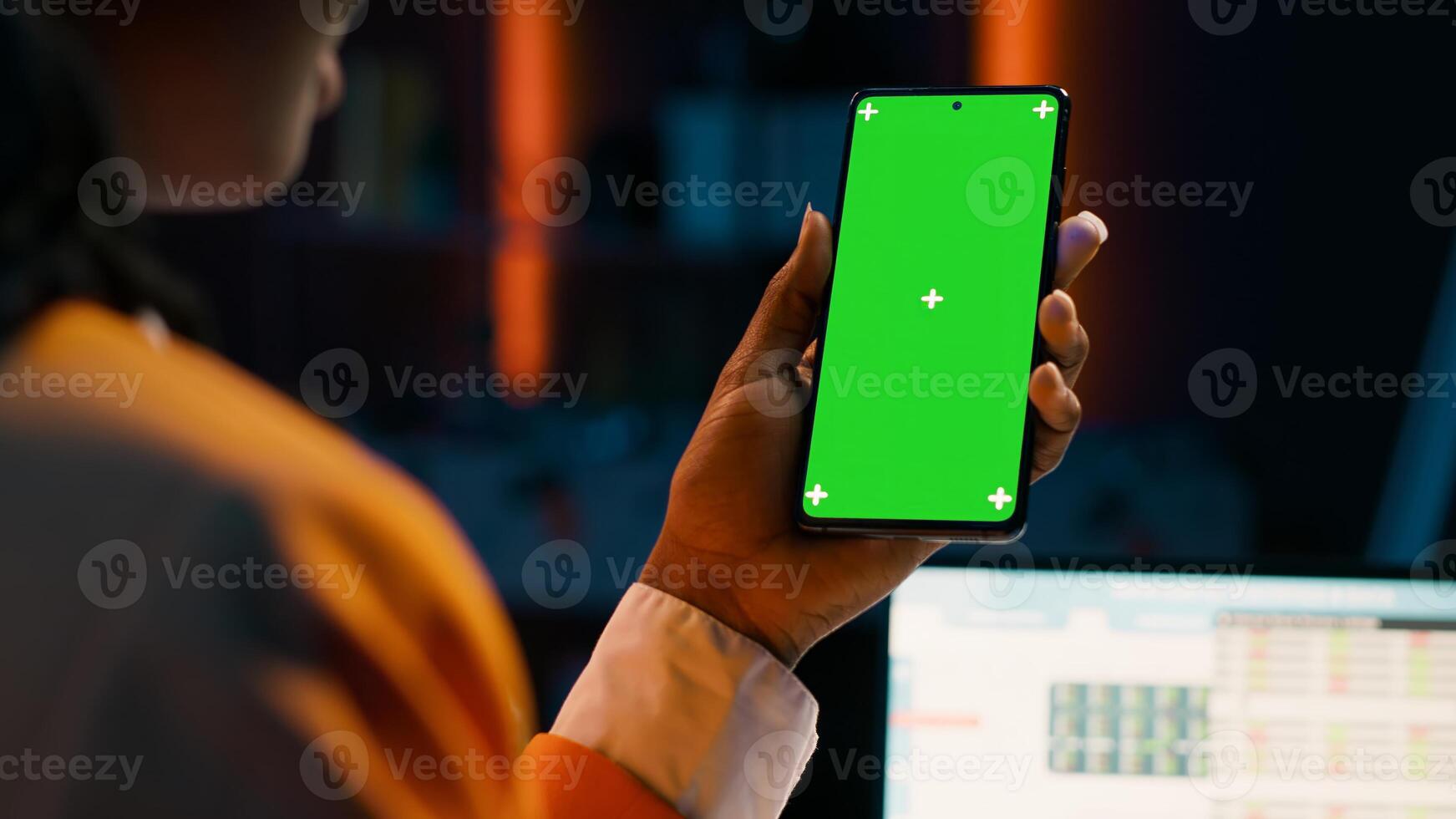 Student uses greenscreen on phone layout while she examines cash plan software for economy course research. Girl learning about expenses and earnings, looks at blank copyspace. Camera A. photo