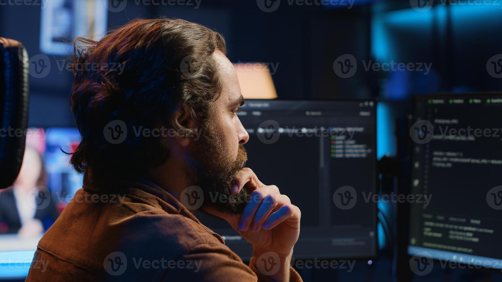 Software engineer puzzled in front of computer screen while writing complex code. Admin feeling confused while trying to fix database errors while working from home, camera A close up photo