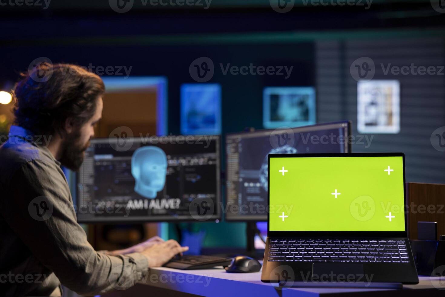 Programmer being asked existential questions by awaken AI gaining consciousness, green screen laptop. Man communicating with artificial intelligence emulating humans, mockup notebook photo