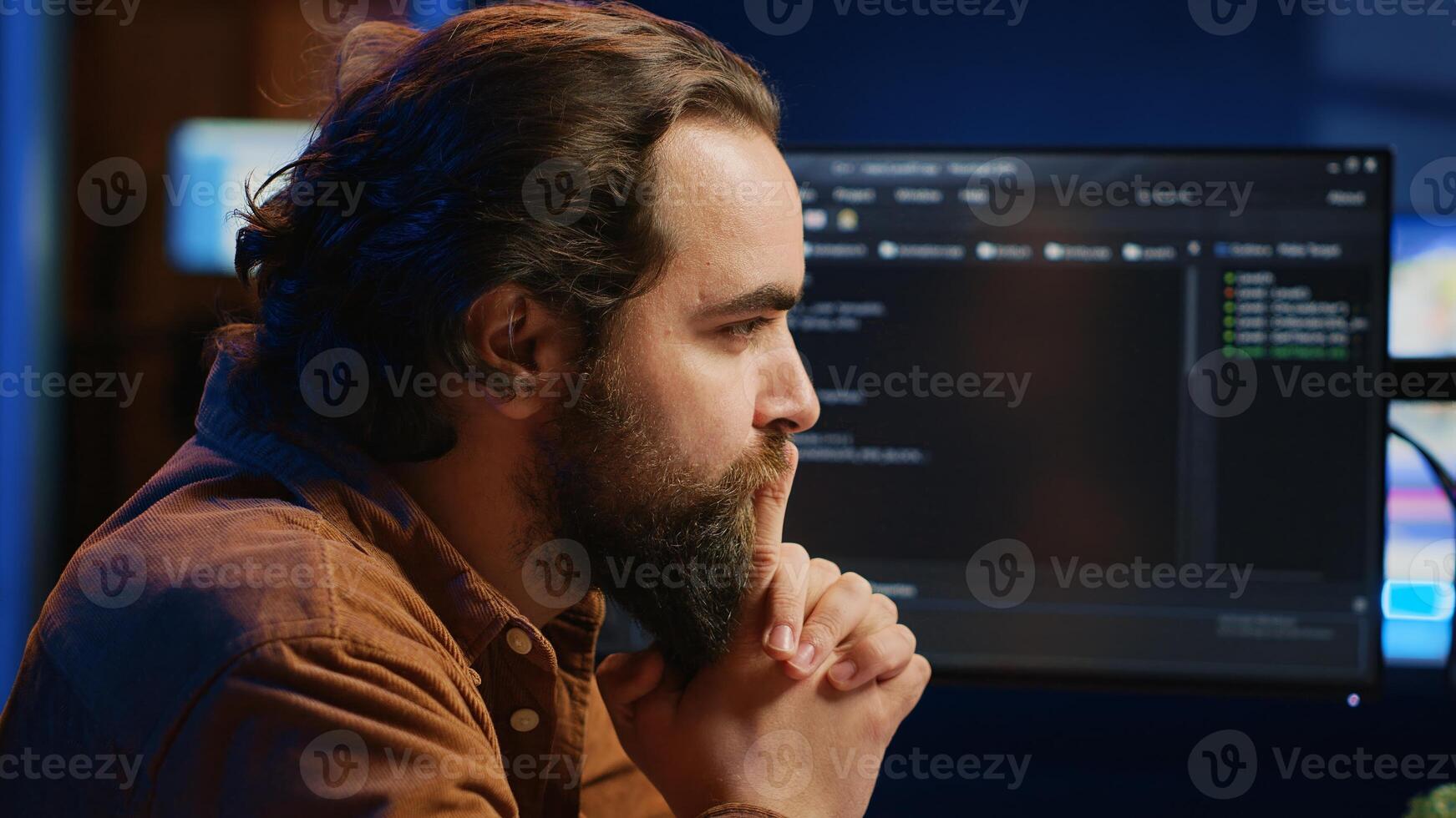 Cheerful software technician feeling satisfied after removing all bugs while coding on computer, close up. Smiling IT expert looking at screen, happy after solving script errors, camera A photo