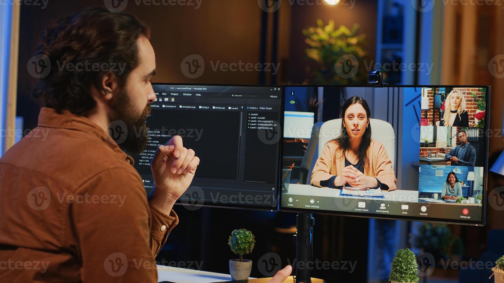Teleworking computer scientist talking with multiethnic team during online videocall, discussing ways to fix programming errors. IT professional at home in remote teleconference meeting with coworkers photo