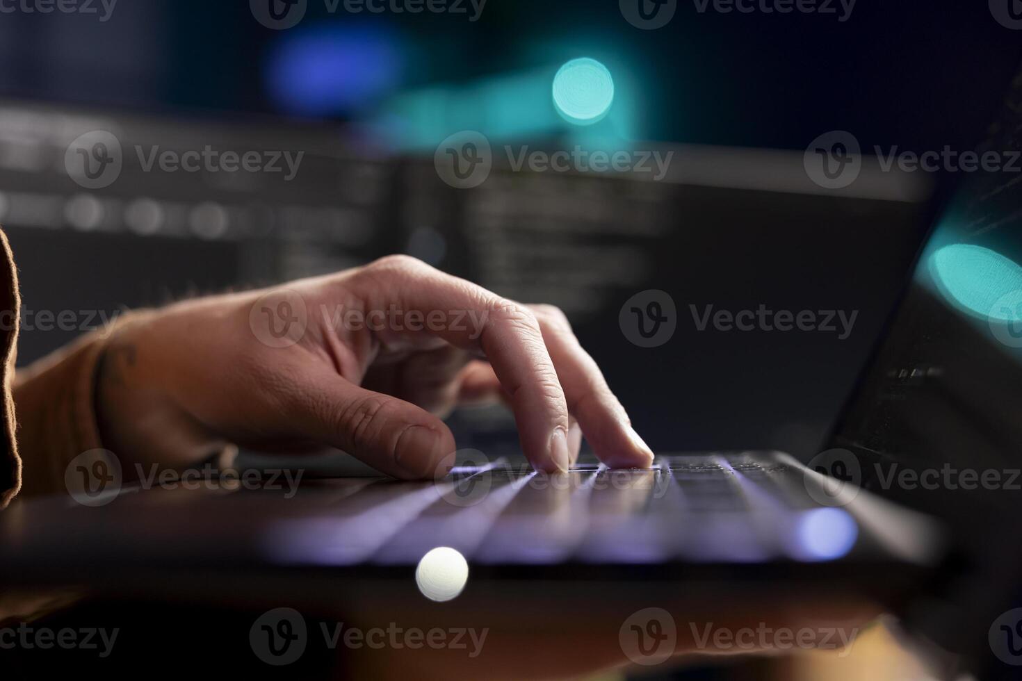 Cybersecurity expert using laptop to look for company security vulnerabilities and prevent malware infections. Developer installing fortified code on notebook to prevent cyberattacks, close up shot photo