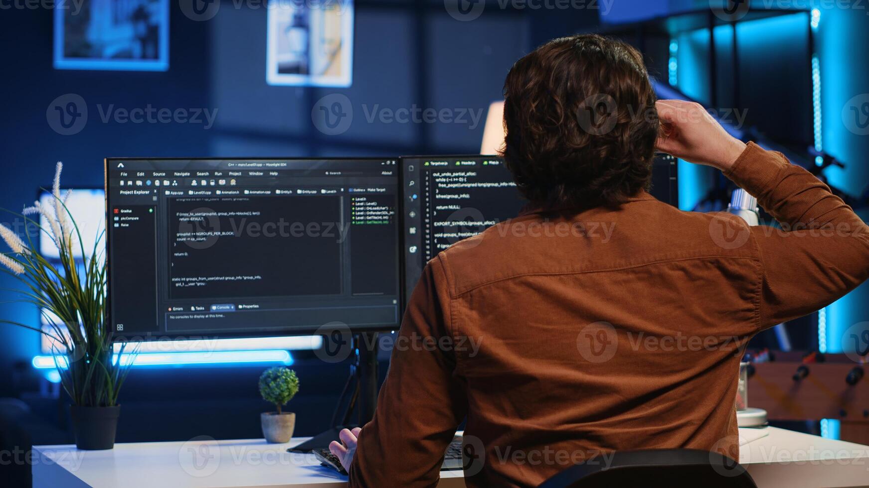 Admin using javascript coding language to fortify security and safeguard consumer data, remotely working for IT company. Software developer upgrading binary code scripts on computer terminal, camera A photo