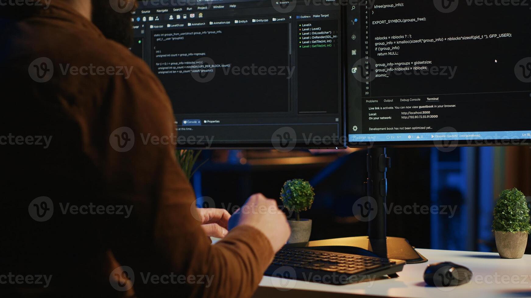Software engineer typing on keyboard buttons, writing lines of code in apartment office. Close up shot of IT expert pressing computer peripheral keys, working from home, programming photo