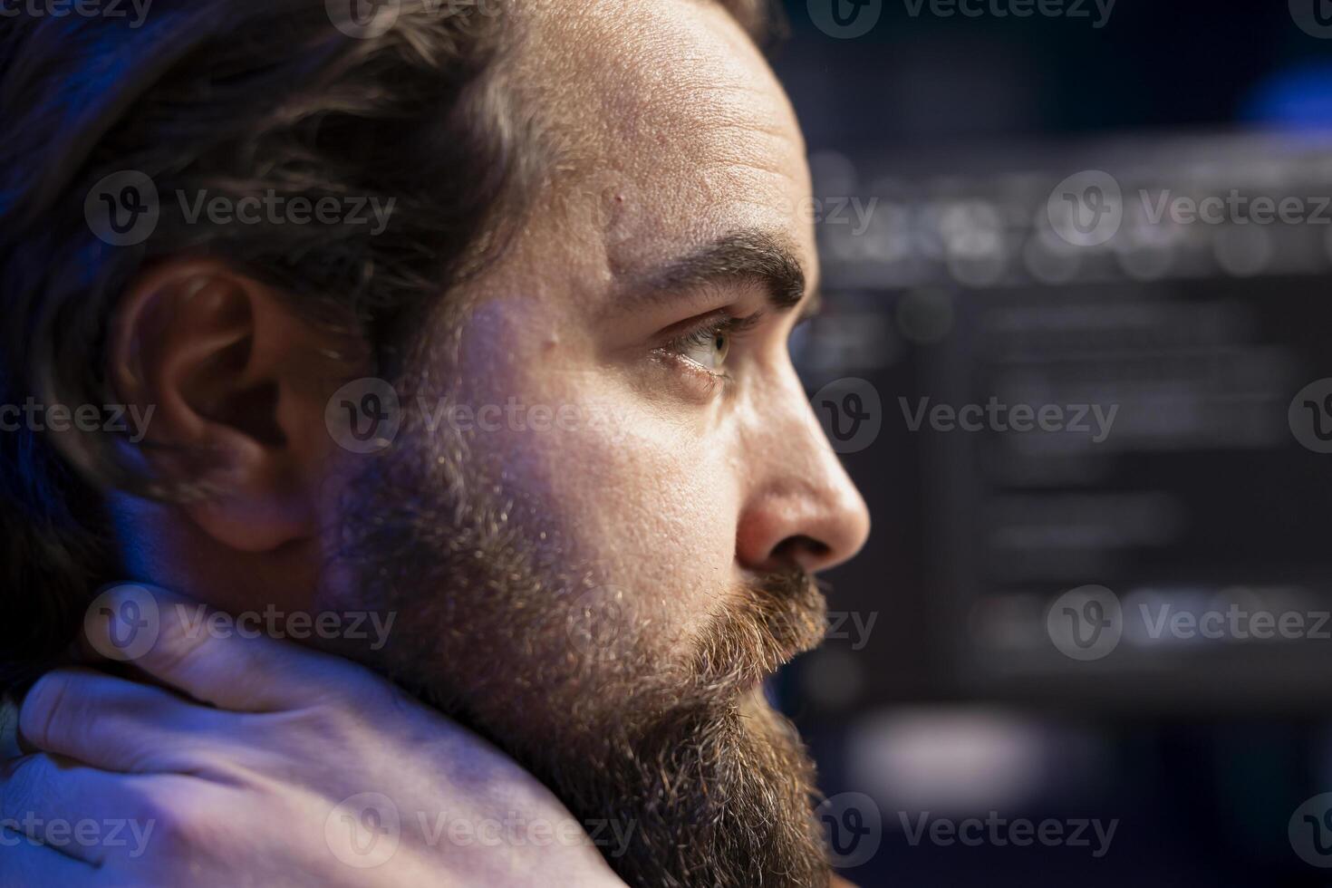 Cybersecurity expert in apartment using computer to look for security liabilities. Programmer focused on installing safeguard code on PC to prevent firewall breaches, close up shot photo