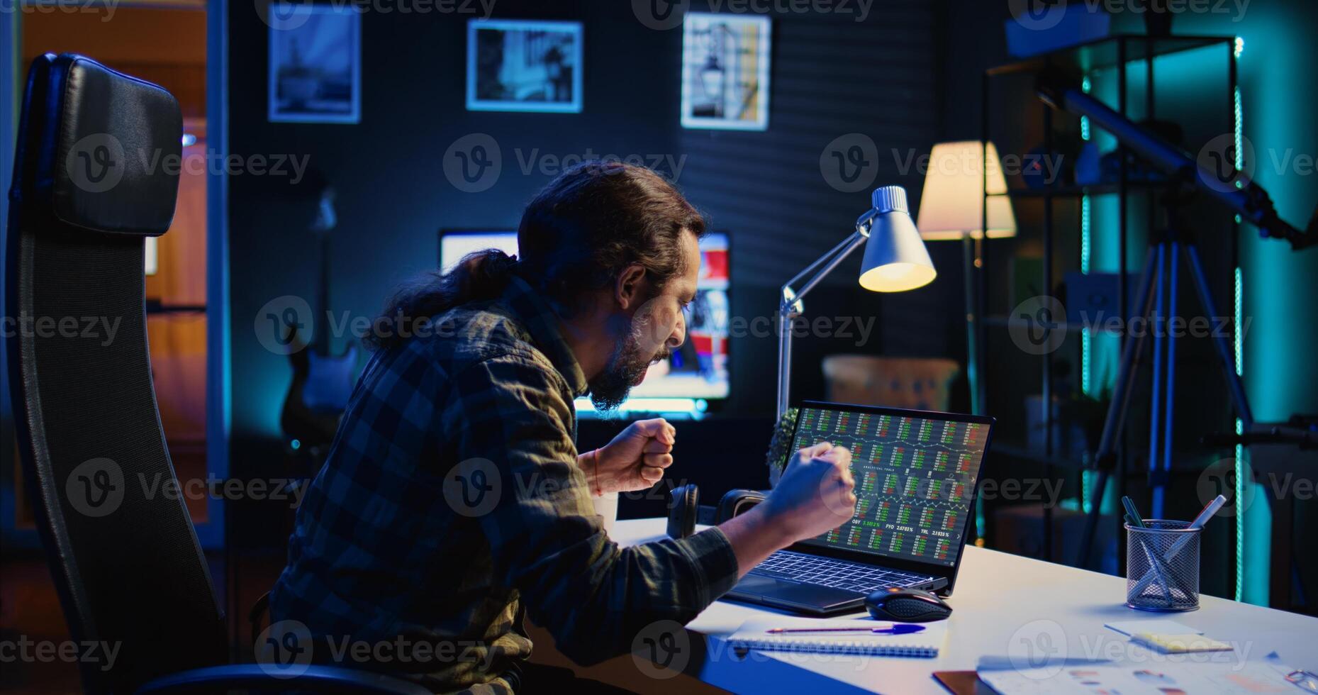 Annoyed broker investor in home office bothered by low stock exchange valuation, screaming after losing money. Angry man yelling and doing facepalm after seeing market shares plummeting, camera B photo