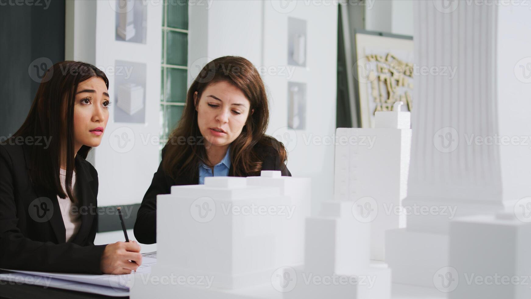 Developers team creating floor plan blueprint in agency office, measuring 3d printed building scale and elements. Architects working with maquette to capture accurate dimensions of physical spaces. photo