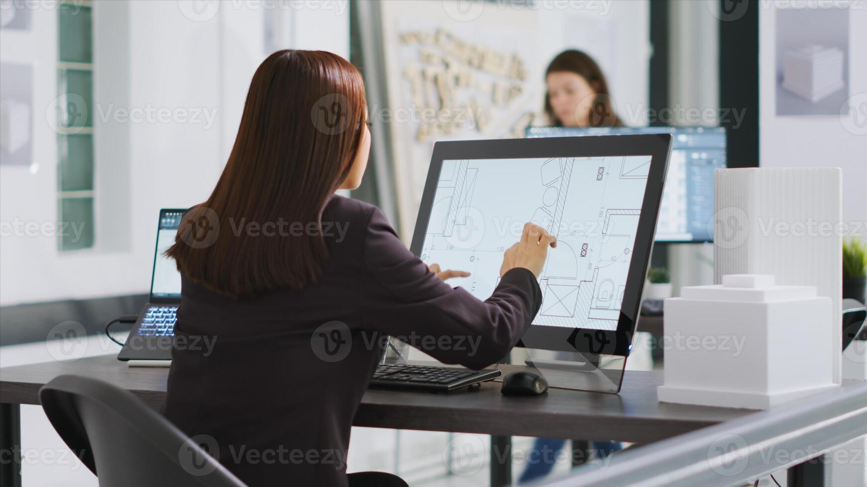 Designer produces plans for household renovation project using CAD program on pc to create new designs for individuals. Technician conducts calculations on interior drawings at workplace. photo