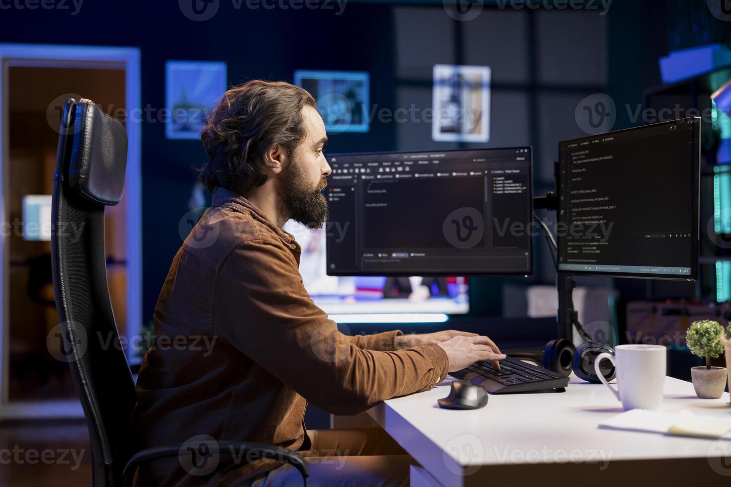 Computer engineer working from home securing company servers from DDoS attacks to avoid unwanted breakdowns. Expert typing on keyboard, writing code to build firewalls protecting data from threats photo