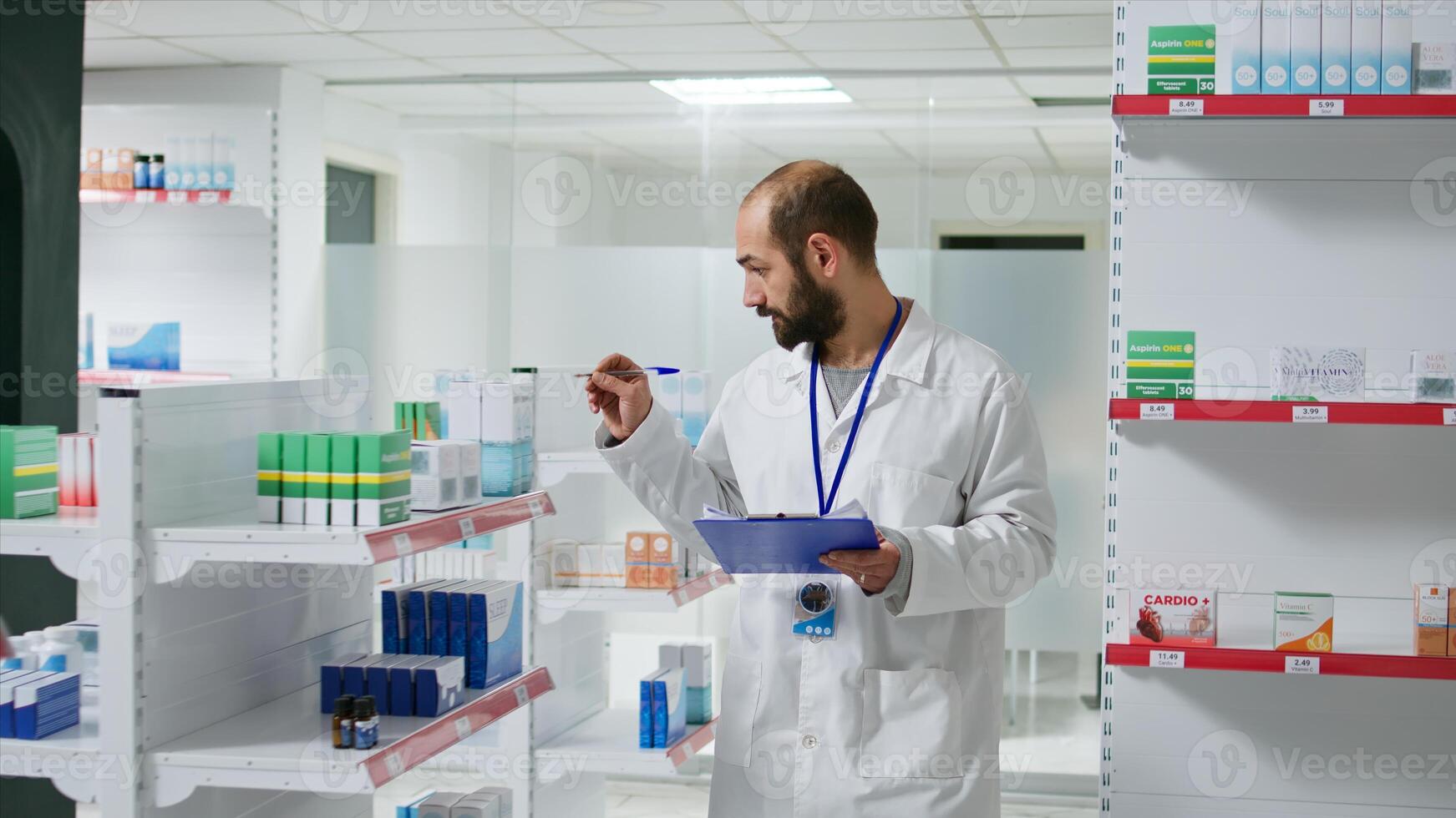 Druggist counting all pharmaceutical stock in pharmacy shop, working on inventory with checklist on clipboard. Pharmacist examining medical products on drugstore shelves. Camera 1. photo