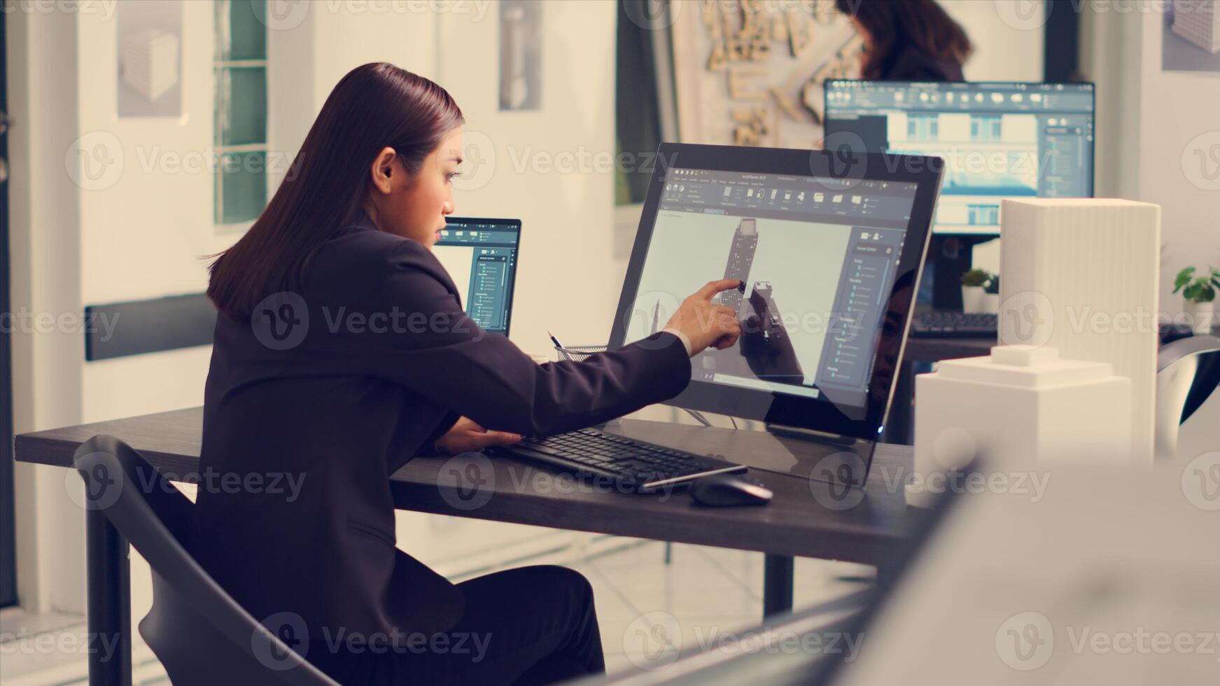 Architect working on building design with graphic software to create layout sketch for architecture project, drawing lines in small business office. Designer manufacturing scale. Handheld shot. photo
