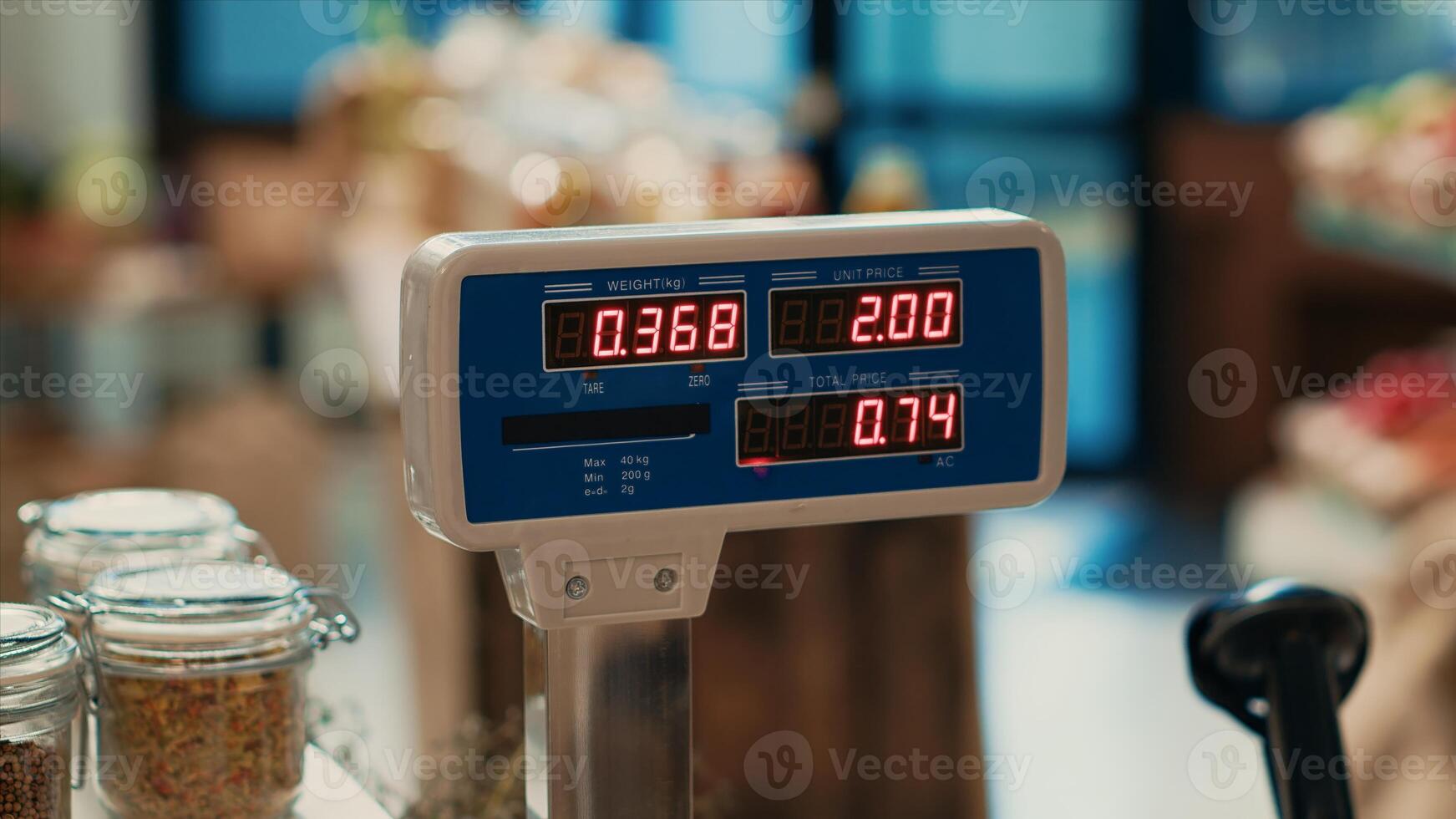 Local grocery store weighting scale at empty checkout counter, small business promoting sustainable lifestyle and organic farming. Bio supermarket selling ethically sourced produce. Close up. photo