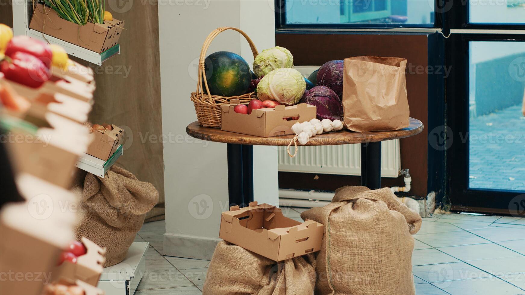 Natural fruits and vegetables displayed in crates on store shelves. Freshly harvested additives free merchandise to support vegan and healthy lifestyle, nonpolluting local farmers market. photo