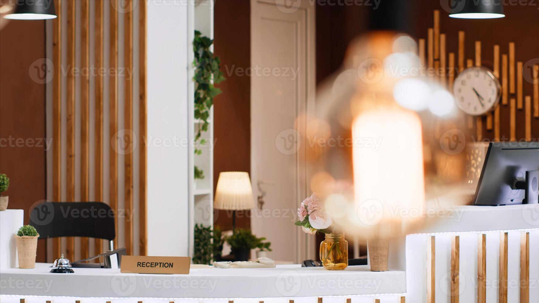 Modern reception counter with classy interior design used for vacation retreat guests to feel comfortable. Empty front desk and lounge area with expensive decorations, luxurious hotel entrance. photo