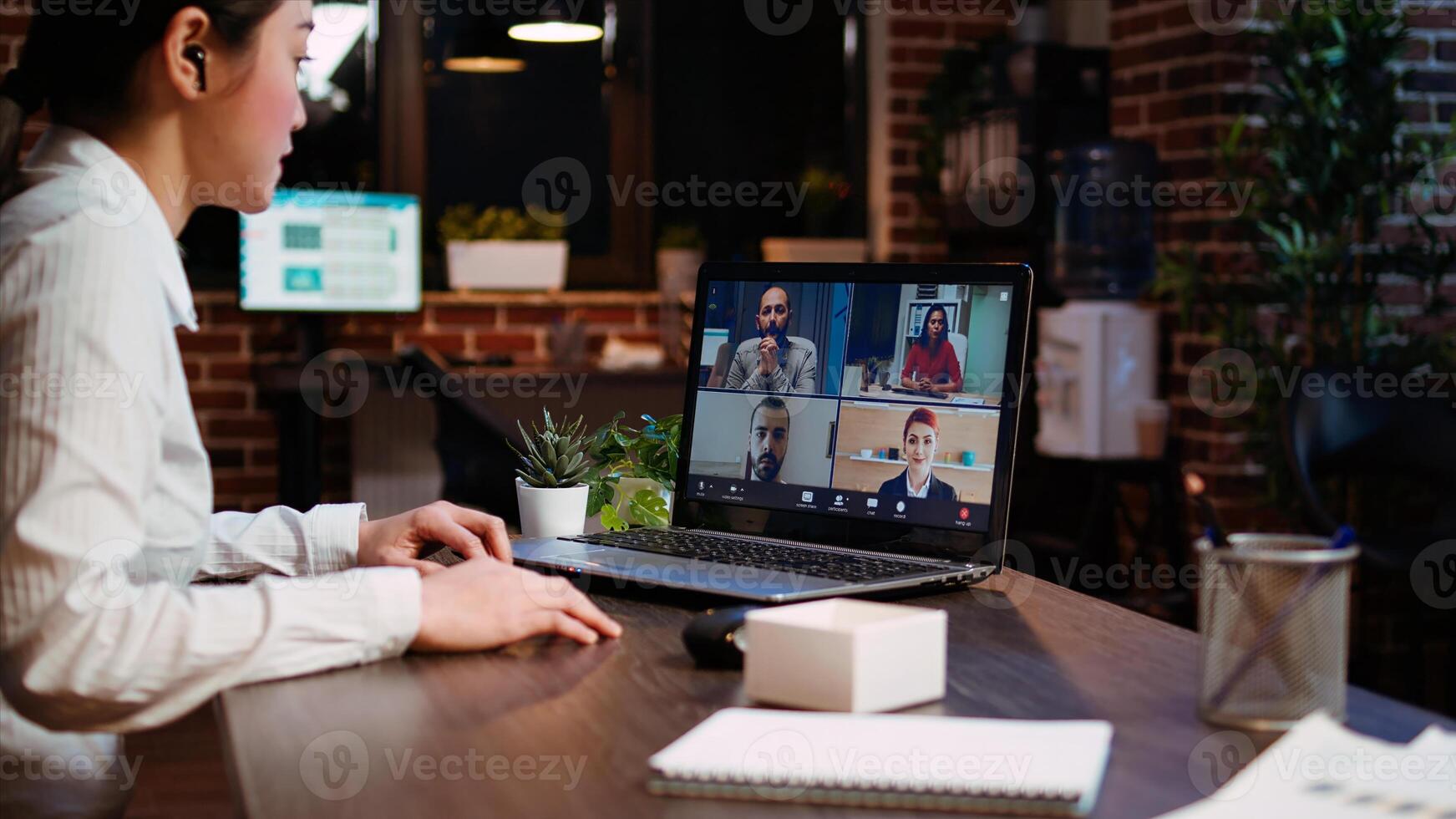 Office clerk making report to board of directors during company meeting on videocall. Worker participating in corporate remote videoconference telework call, presenting project photo