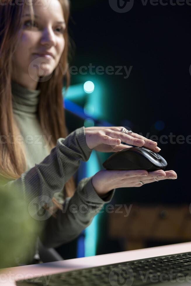Teenage entertainer presenting mouse from brand sponsoring , urging viewers to buy it. Media star does influencer marketing by advertising computer peripherals, close up photo