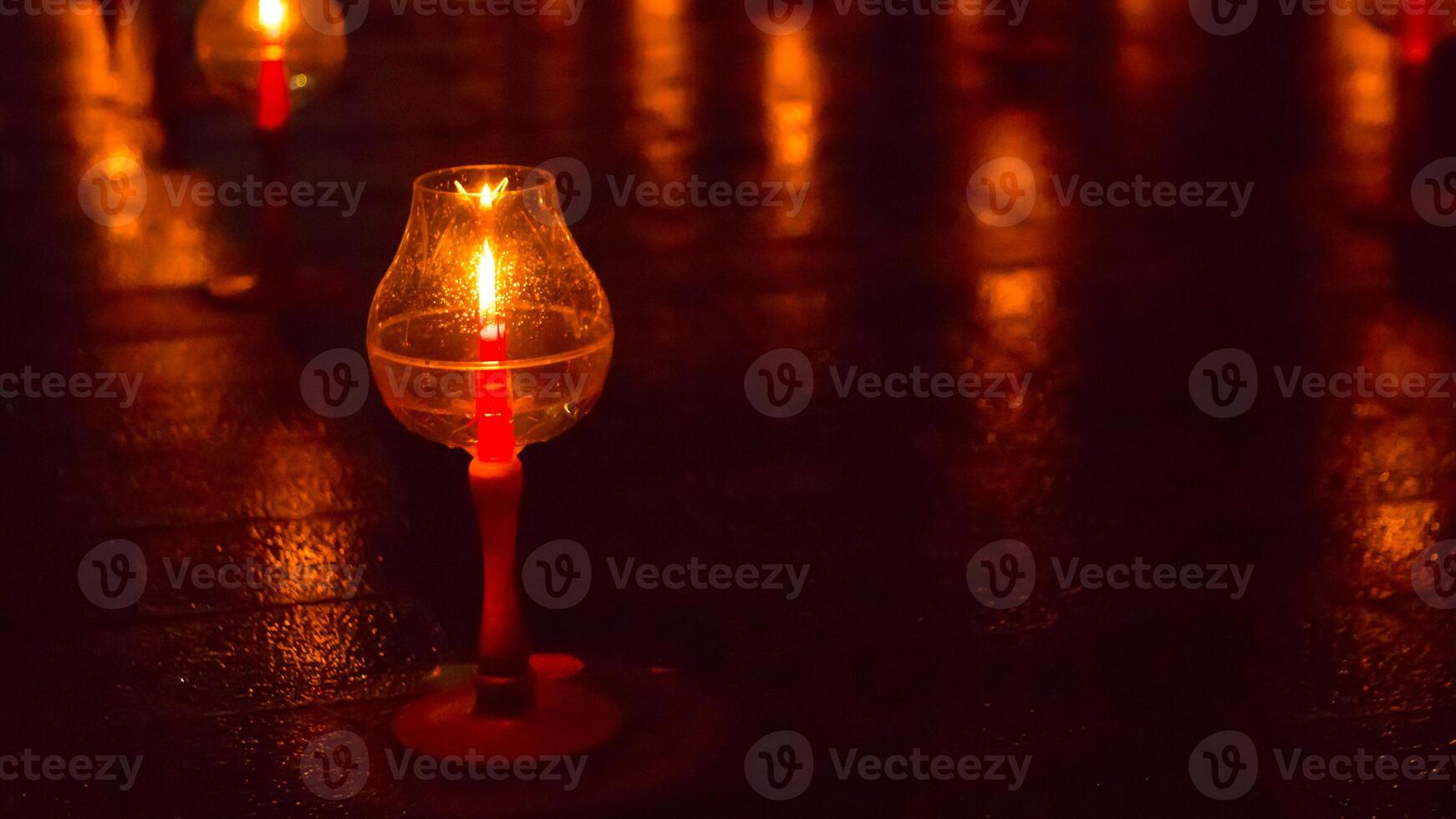 A candle is are lit at borobudur temple. symbol of hope photo