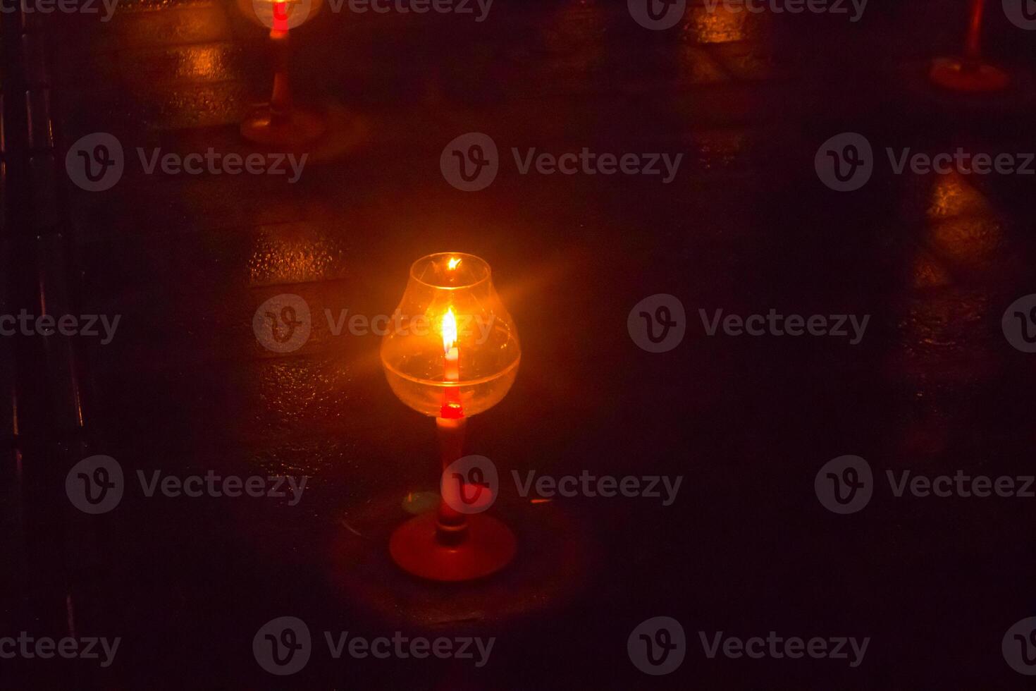 A candle is are lit at borobudur temple. symbol of hope photo