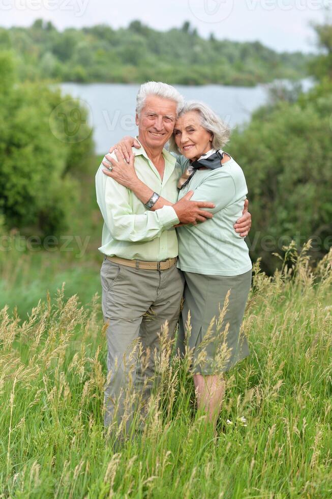Portrait of senior couple resting in the park photo