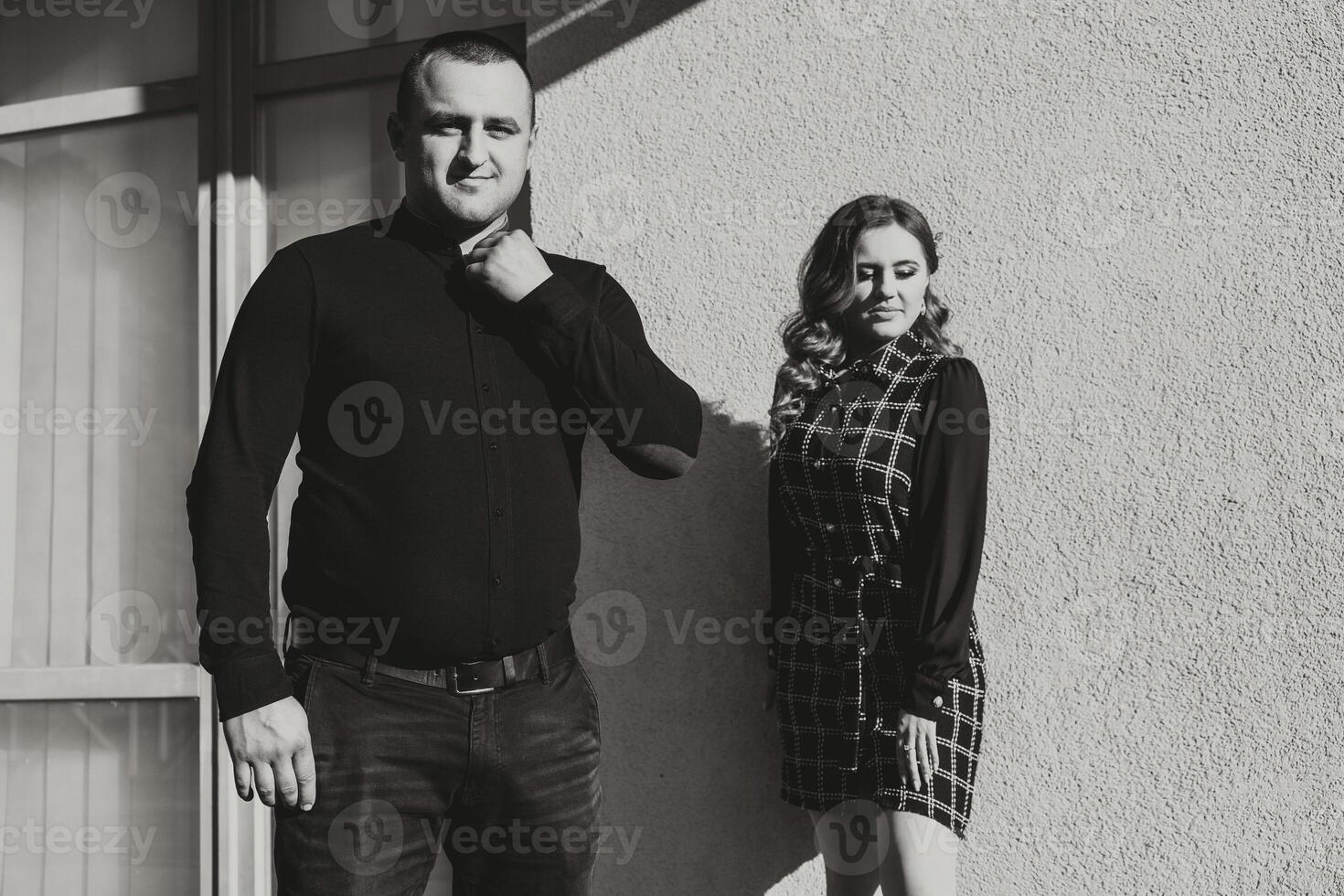 A man and a woman are standing next to each other photo