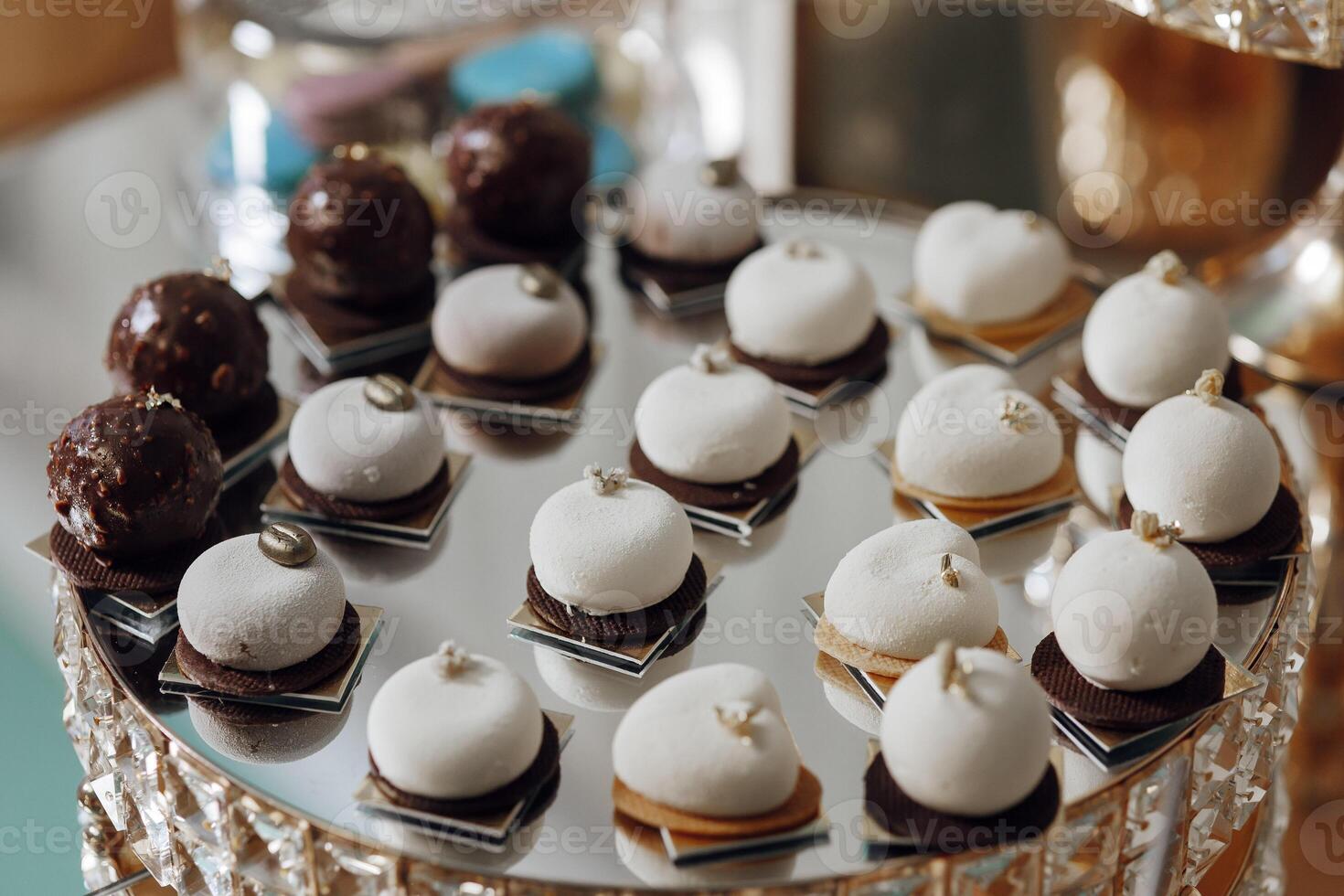A tray of assorted desserts, including cookies and cakes photo