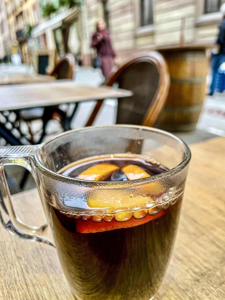 Mulled wine with oranges and cinnamon photo