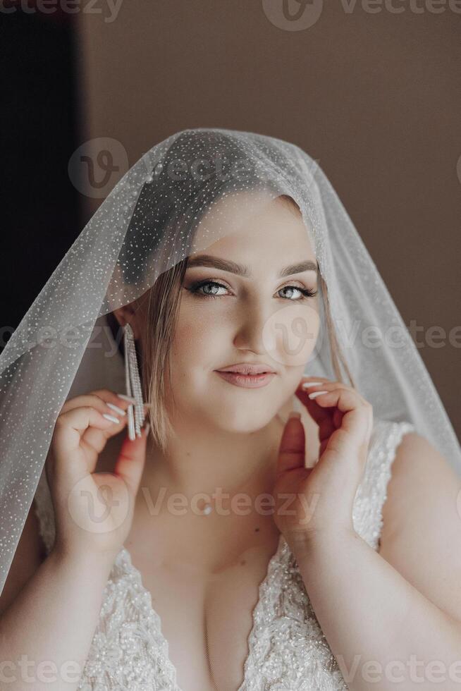 A woman is wearing a veil and is posing for a picture photo